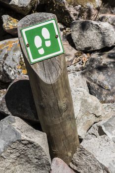 Hiking route in Cape Town to Table Mountain. Signpost with footprints.