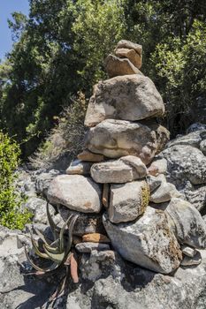 Stacked stones as a guide for hikers in Table Mountain National Park in Cape Town, South Africa.