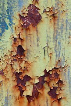 Flaking old and cracked paint from rusty iron - design flaw