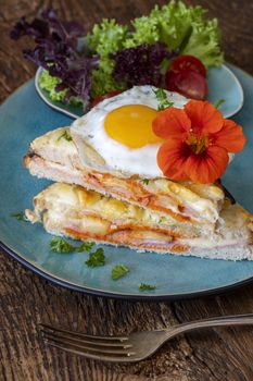 french croque madame on a blue plate