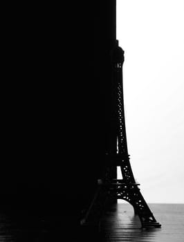 The silhouette of the eiffel Tower figurine on a black white background. High quality photo