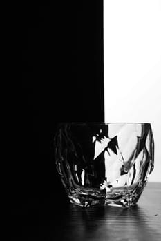 one glass of whiskey on a black white background. Silhouette photo. High quality photo
