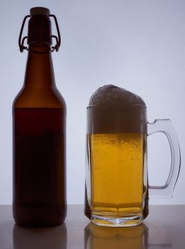 colored silhouette of a beer bottle with a cork on a black white background. Hight quality photo