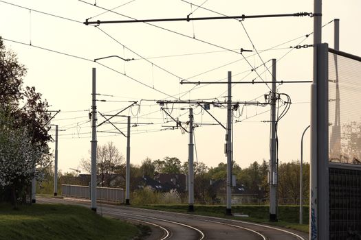 Tram rails and cables scenery. Tramway tracks and traction photo. Overhead electric wires and trail infrastructure photography. Downtown transport structure.