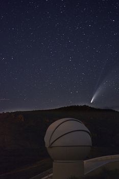 Neowise comet in starry sky, astronomical observatory, night photography, astrophotography