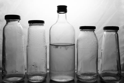 composition of glass bottles on a light background. High quality photo