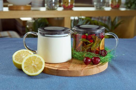 Kazakh airan tea with lemon lie on a blue tablecloth closeup photo