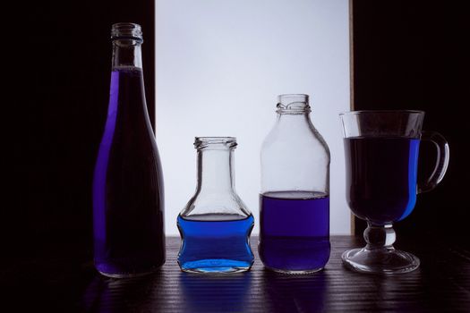 bottled on a light background with blue liquid. Hight quality photo