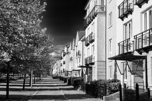Modern new terraced houses and apartment flats in Cardiff Wales UK black and white image stock photo