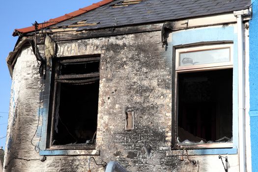 Burnt remains of a house property after an accidental house fire stock photo