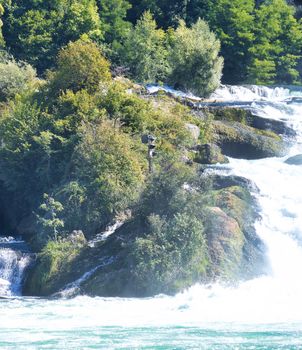 the famous rhine falls in the swiss near the city of Schaffhausen - sunny day and blue sky