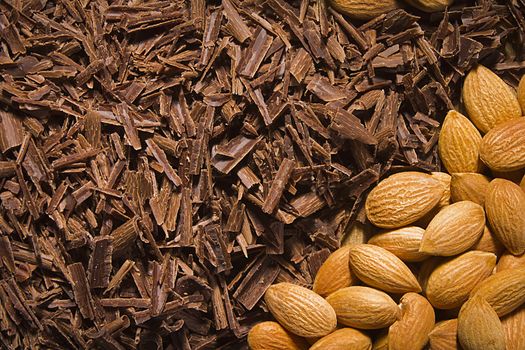 Almond nuts and delicious grated chocolate closeup