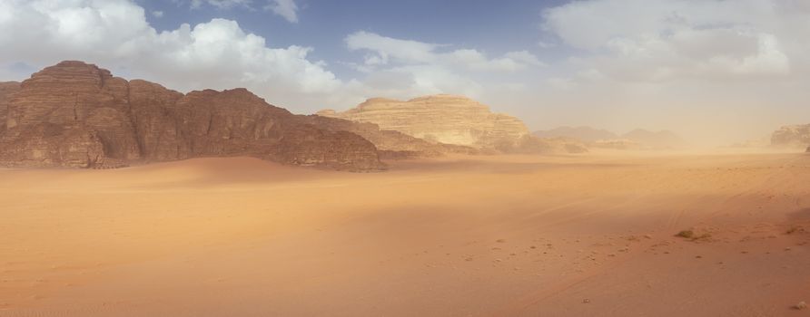 Wadi Rum protected area in Jordan, panorama landscape of the desert and rock formation. Travel tourism and nature.