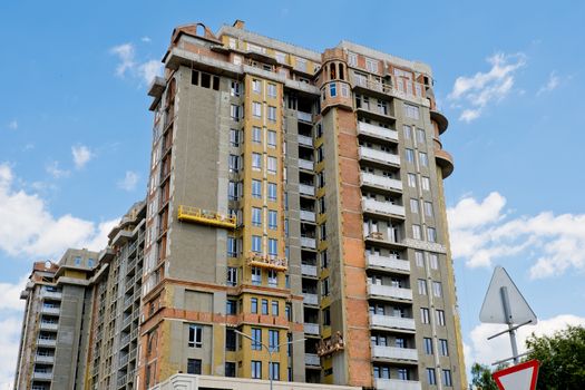 Unfinished new modern high-rise building in the city.