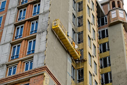 Unfinished new modern high-rise building in the city.