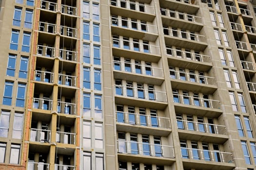 Unfinished new modern high-rise building in the city.