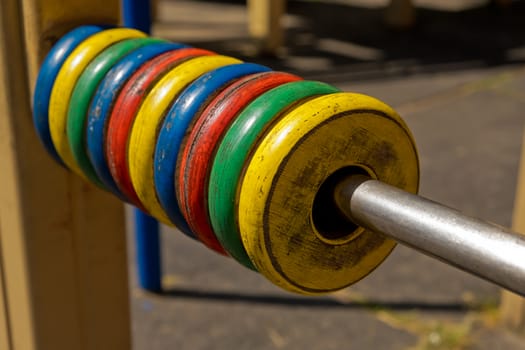 Large colored children's abacus, wooden rings. Closeup.