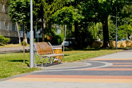 Bench on the alley in the park.