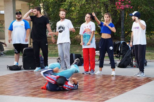 Varna, Bulgaria - July, 19, 2020: young people dancing break dance on the street of Varna