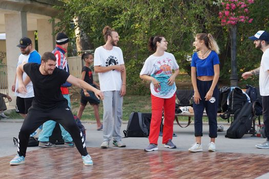 Varna, Bulgaria - July, 19, 2020: young people dancing break dance on the street of Varna