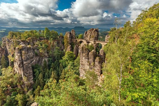 Bastei, view of the Bastei bridge and stone gate. Bastei is famous for the beautiful rock formation in the Saxon Switzerland National Park near Dresden. Popular travel destination in Saxony.




