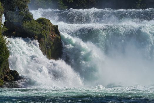 the famous rhine falls in the swiss near the city of Schaffhausen - sunny day and blue sky