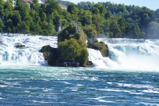 the famous rhine falls in the swiss near the city of Schaffhausen - sunny day and blue sky