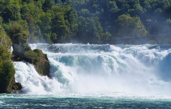 the famous rhine falls in the swiss near the city of Schaffhausen - sunny day and blue sky