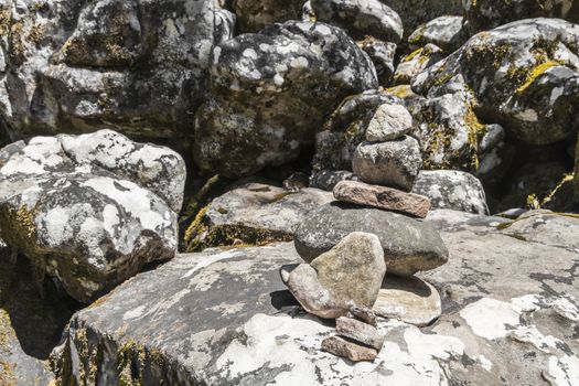 Stacked stones as a guide for hikers in Table Mountain National Park in Cape Town, South Africa.