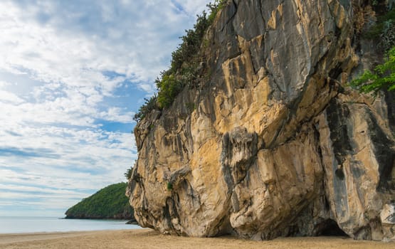 Khao Kalok rock mountain on Khao Kalok beach in Thailand. Natural attractions in Thailand travel. The Khao Kalok rock mountain and green tree 
background