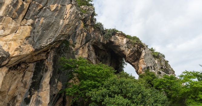 Khao Kalok rock mountain on Khao Kalok beach in Thailand. Natural attractions in Thailand travel. The Khao Kalok rock mountain and green tree 
background