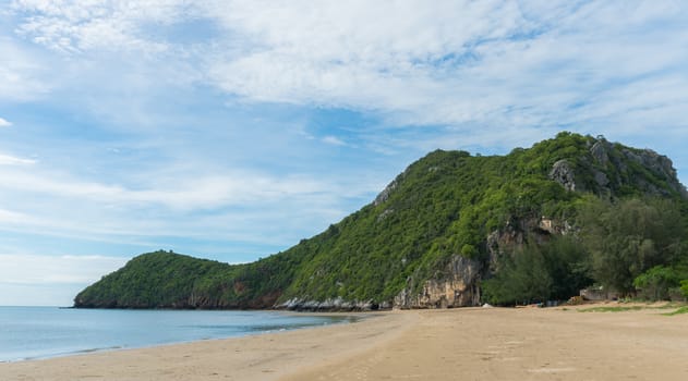 Khao Kalok rock or stone mountain on Khao Kalok beach in Thailand. Natural attractions in Thailand travel. The Khao Kalok rock mountain and 
green tree background