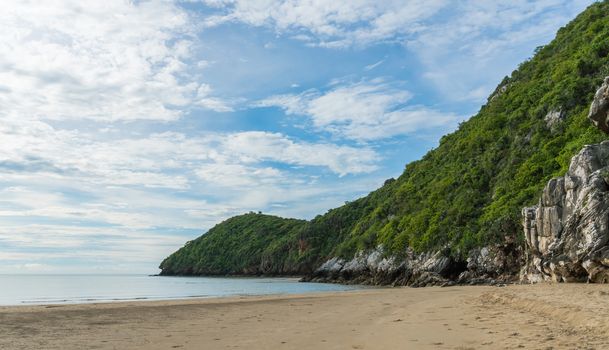 Khao Kalok rock or stone mountain on Khao Kalok beach in Thailand. Natural attractions in Thailand travel. The Khao Kalok rock mountain and green tree 
background