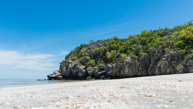 Rock or stone mountain or hill and blue sky low angle view at Sam Phraya beach Prachuap Khiri Khan Thailand. Landscape or scenery in 
natural for summer concept