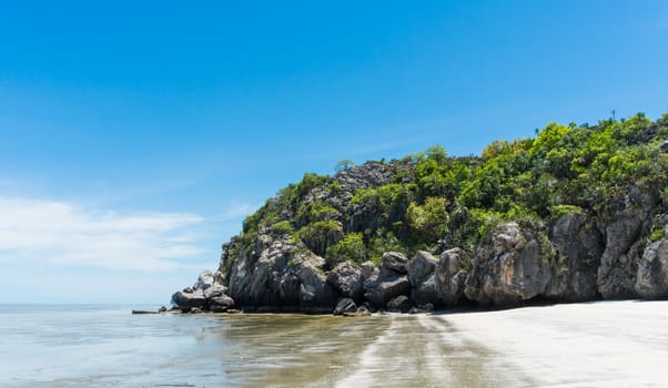 Rock or stone mountain or hill and blue sky low angle view at Sam Phraya beach Prachuap Khiri Khan Thailand. Landscape or scenery in 
natural for summer concept