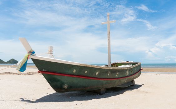 Fishing boat or fisherman boat or ship on Sam Roi Yod bech Prachuap Khiri Khan Thailand with blue sky and cloud and blue sea and mountain or hill. Landscape or scenery for summer season concept