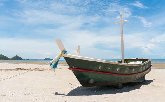 Fishing boat or fisherman boat or ship on Sam Roi Yod bech Prachuap Khiri Khan Thailand with blue sky and cloud and blue sea and mountain or hill. Landscape or scenery for summer season concept