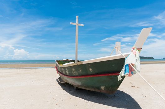 Fishing boat or fisherman boat or ship on Sam Roi Yod bech Prachuap Khiri Khan Thailand with blue sky and cloud and blue sea and mountain or hill. Landscape or scenery for summer season concept