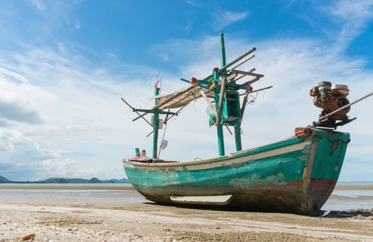 Green Fishing Boat or Fisherman Boat or Ship and blue sky and mountain or hill at Sam Roi Yod Beach Prachuap Khiri Khan Thailand. Landscape 
or scenery for summer season concept