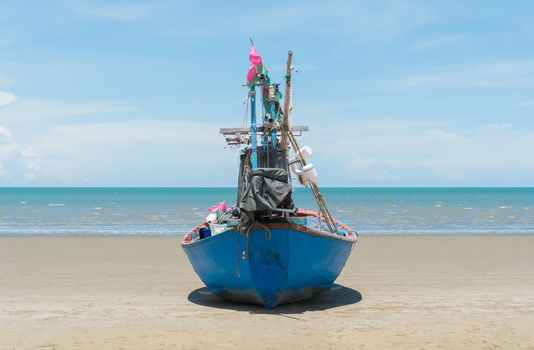 Blue fishing boat or fisherman boat or ship on Sam Roi Yod bech Prachuap Khiri Khan Thailand with blue sky and cloud and blue sea. Landscape or scenery for summer season concept