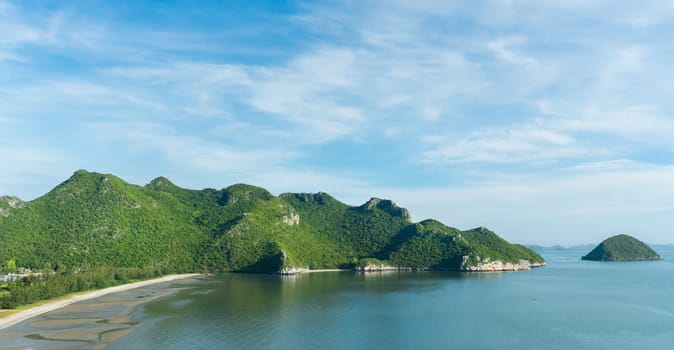 Green Rock or Stone Mountain or Hill and blue sky at Bang Pu Beach Prachuap Khiri Khan Thailand. Landscape or scenery summer season 
concept