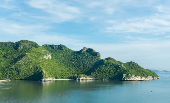 Green Rock or Stone Mountain or Hill and blue sky at Bang Pu Beach Prachuap Khiri Khan Thailand. Landscape or scenery summer season 
concept