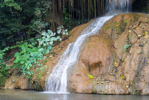 Nam Tok Phu Sang Forest Park or Phu Sang Waterfall Phayao Attractions Thailand Travel Zoom. Natural Nam Tok Phu Sang Forest Park or Phu Sang Waterfall with landscape green tree and 
stone. Northern Thailand travel