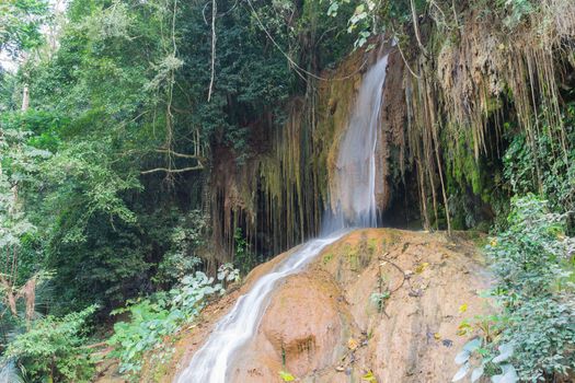 Nam Tok Phu Sang Forest Park or Phu Sang Waterfall Phayao Attractions Thailand Travel Low Angle. Natural Nam Tok Phu Sang Forest Park or Phu Sang Waterfall with landscape green tree and 
stone. Northern Thailand travel