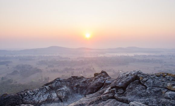 Sunrise at Pha Hua Rue Phayao Attractions Thailand Travel. Natural stone or rock mountain with sunrise sky and mist at Phayao northern Thailand travel