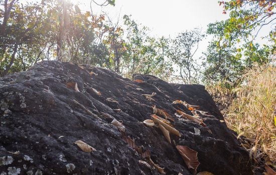 Black Stone or Rock Cliff Mountain Hill on Tree and Sky Background. Natural attractions in Phayao northern Thailand travel