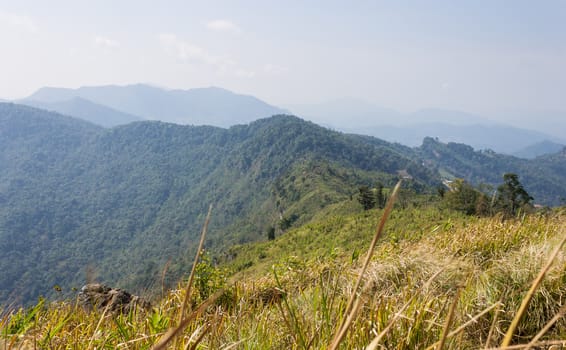 Phu Chi Fa Forest Park with Grass Field Green Mountain Sky and Cloud. Phu Chi Fa forest park view point Chiang Rai Northern Thailand travel