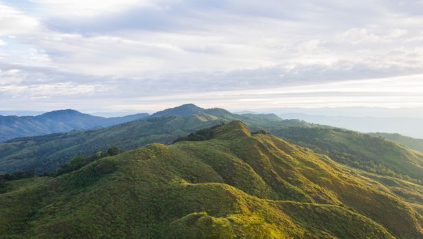 Landscape Phu Langka Mountain National Park Phayao Thailand Travel Wide. Green tree mountain and cloud sky and warm sun light at Phu Langka national park view point 
Phayao Thailand. Northern Thailand travel