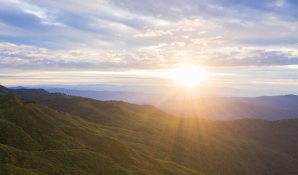 Landscape Mountain Sunrise Cloud Blue Sky at Phu Langka National Park Phayao Thailand. Sunrise and green tree mountain blue sky cloud in winter at Phu Langka National Park 
Phayao Thailand view point