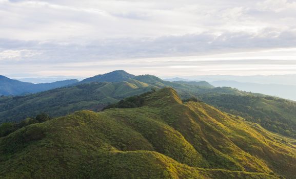 Landscape Phu Langka Mountain National Park Phayao Thailand Travel Zoom. Green tree mountain and cloud sky and warm sun light at Phu Langka national park view point 
Phayao Thailand. Northern Thailand travel